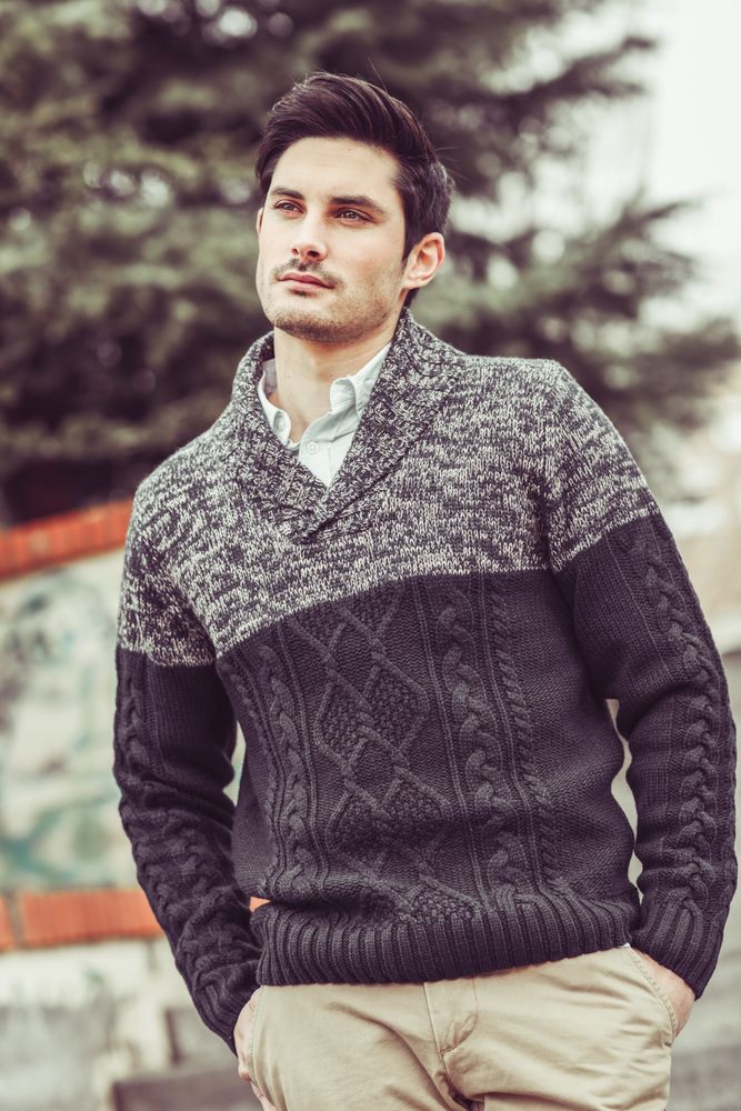 Man lost in thought outside in woolen sweater