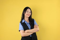 Asian Young Women  Standing Confident with Arms Crossed, Smiling Pleased