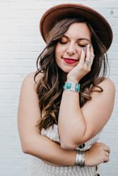 Woman closing eyes standing in white background
