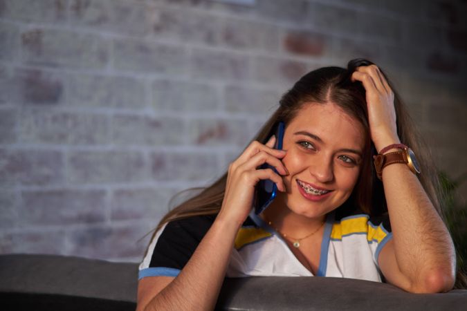 Woman smiling talking on the phone