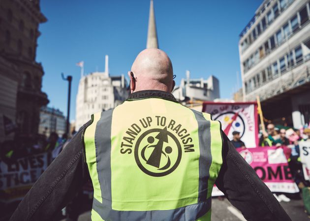 London, England, United Kingdom - March 19 2022: High visibility jacket with “Stand up to Racism”