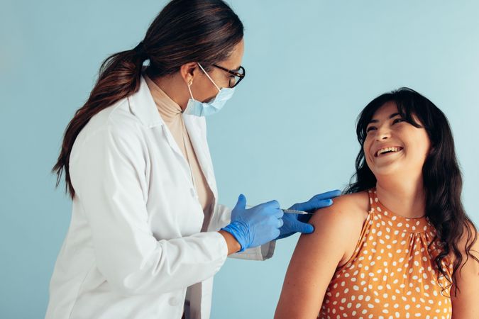 Smiling woman getting vaccinated