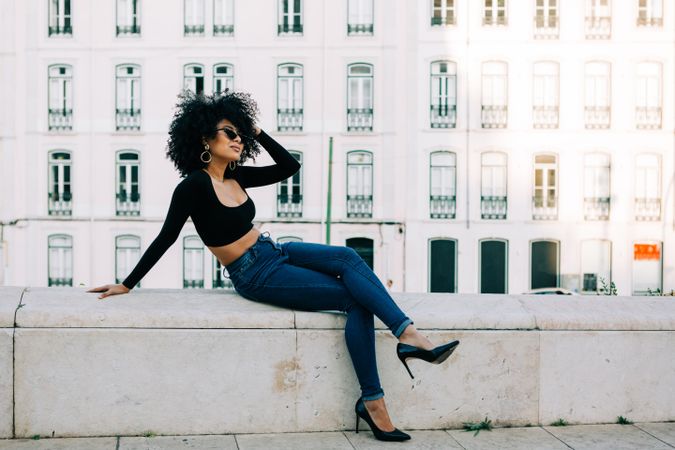 Fashionable female relaxing in city