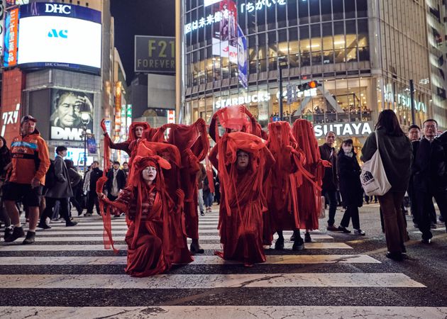 Japan - Tokyo, Shibuya Japan - November 29th, 2019: Red Rebel Brigade kneeling on crosswalk