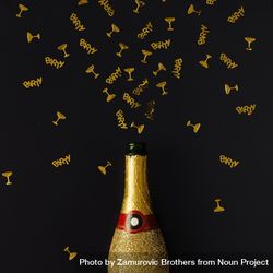 Golden champagne party bottle on background with gold confetti 5XKqP0