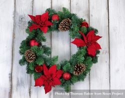 Holiday Poinsettia Christmas wreath on rustic wood 47RKB5