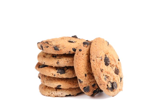 Stack of tasty chocolate chip cookies on blank background