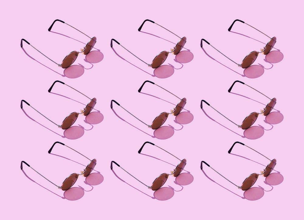 Sunglasses on pink background