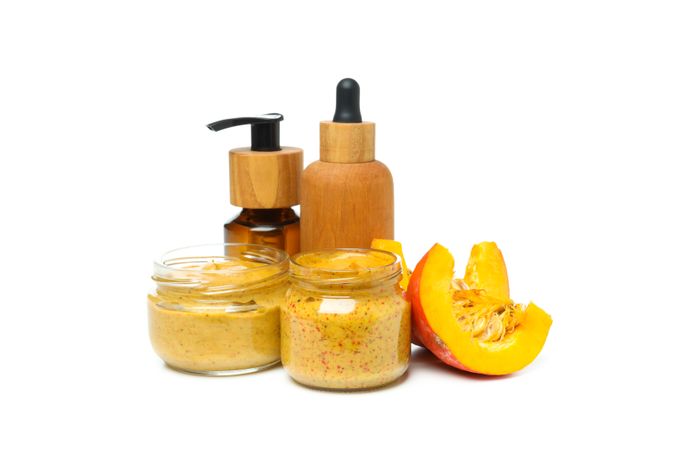Concept of different cosmetic products, Pumpkin cosmetics, isolated on light background