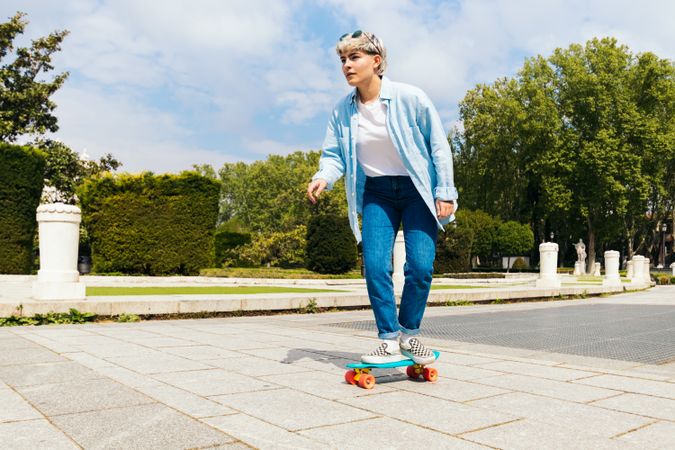 woman skating on a city square. side view