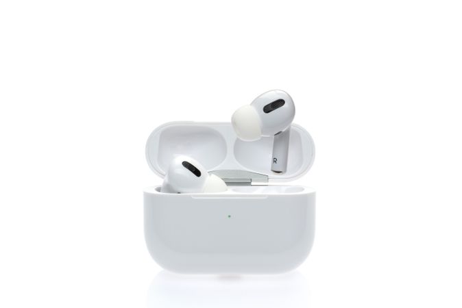 Wireless earbuds on plain background