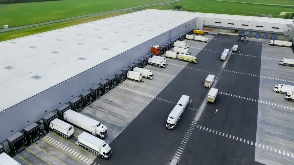 Aerial Shot of Loading Area where Many Trucks Are Loading