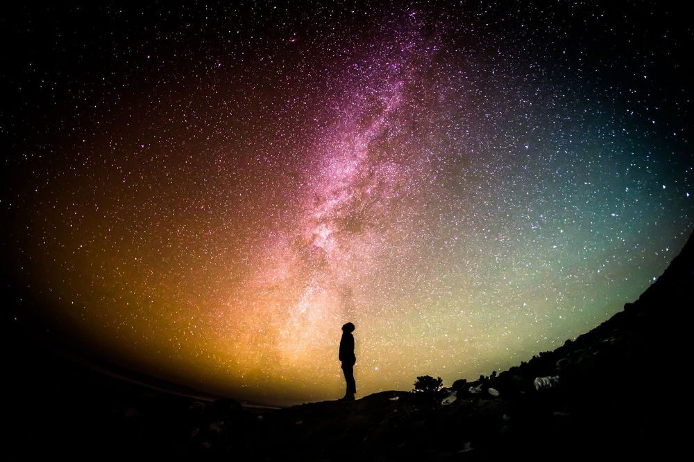 Milky Way and stars with silhouette of a man