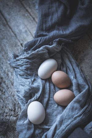 Raw eggs on tablecloth