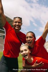 Female soccer team celebrating success 4jOBrb