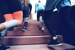 Athletes jogging up stairs