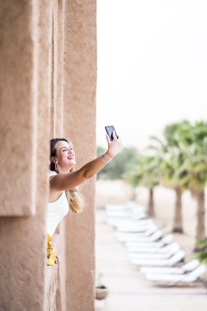 Woman making a selfie in balcony