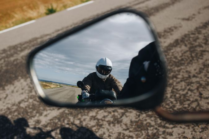 Motorcyclist as seen in rear-view mirror