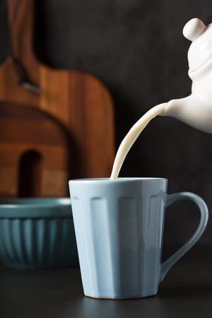 Cup of coffee with creamy milk.