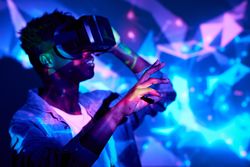 Content Black man in VR headset in neon lights