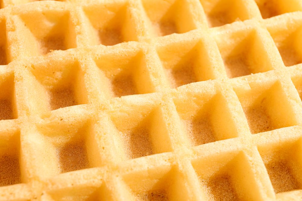 Belgian waffles texture as background, closeup