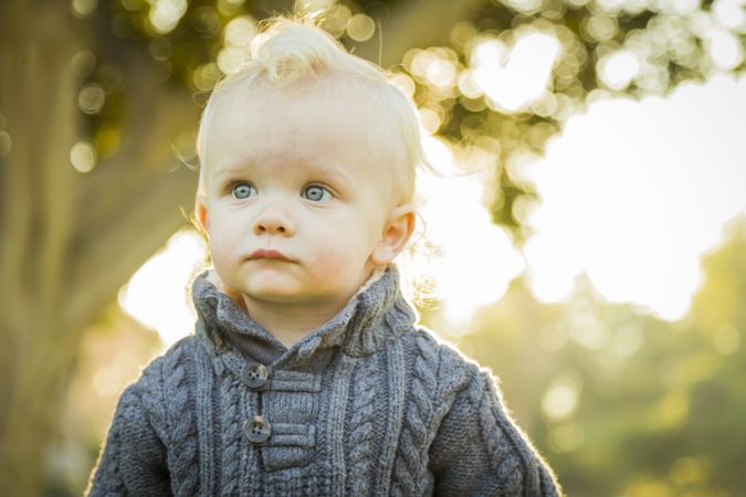 Adorable Blonde Baby Boy Outdoors at the Park.