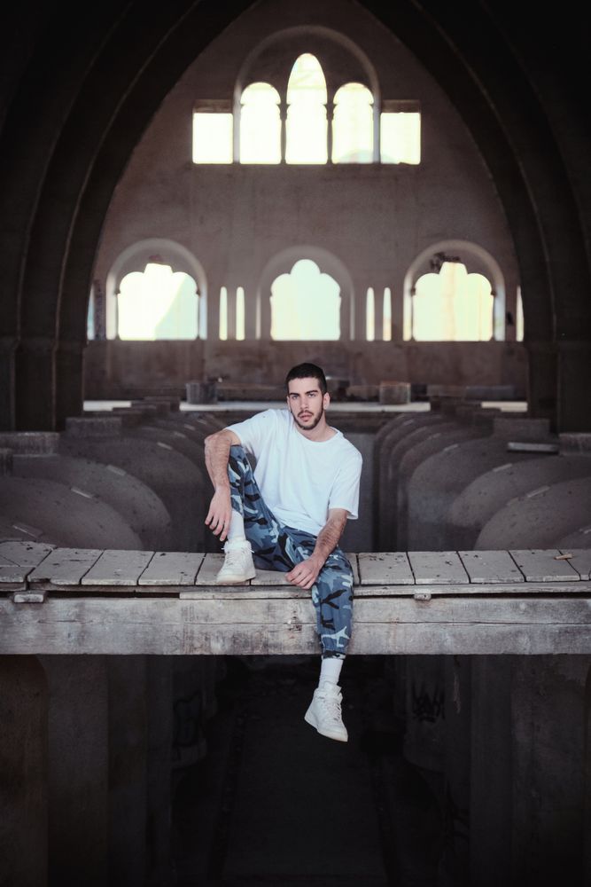 Serious man in abandoned industrial building
