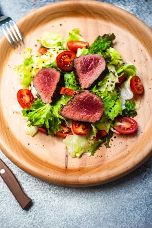 Top view of steak salad with fresh lettuce