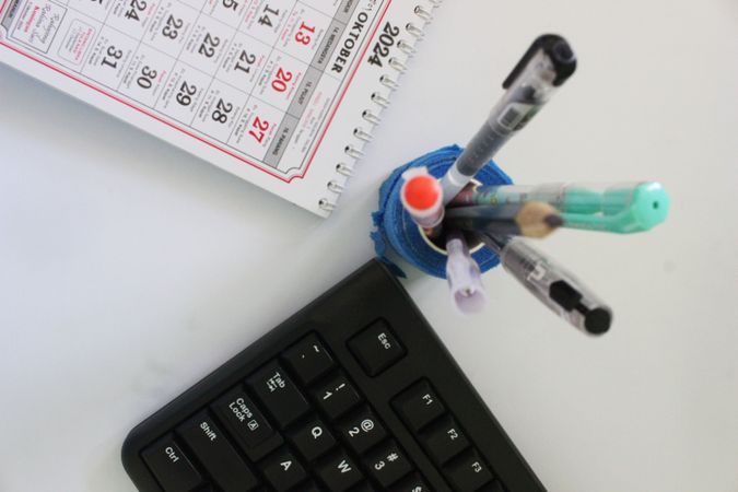 Layout Featuring Pencils Keyboard and Daily Planner