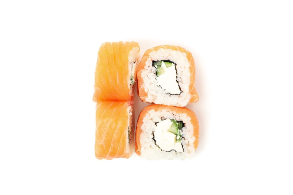 Japanese food. Delicious sushi rolls isolated on light background