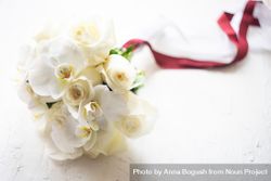Wedding bouquet with roses and orchids 0LdExD