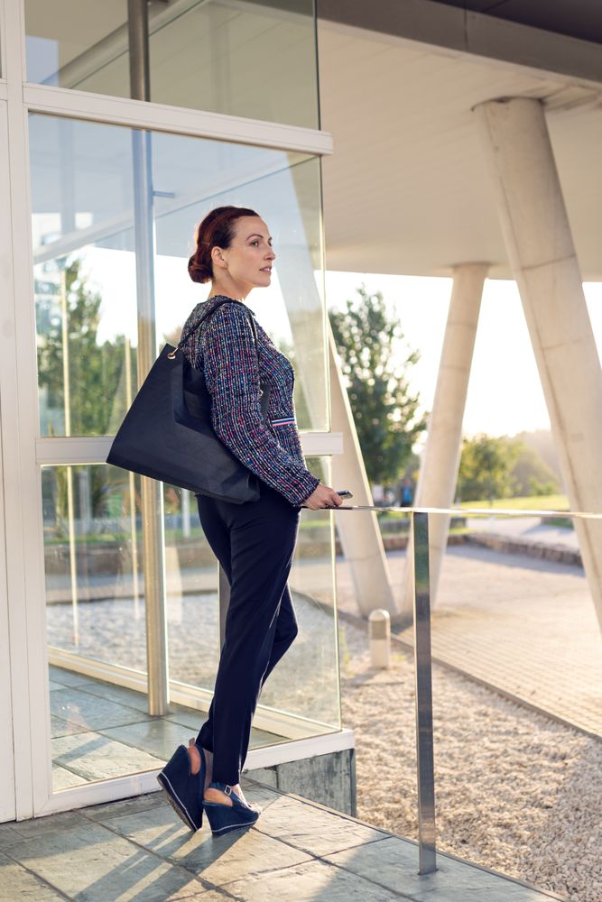 Smiling businesswoman using the cellphone