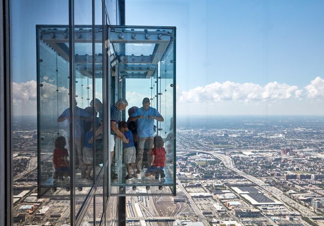 A glass elevator outside the 100th floor of a building in downtown Chicago, Illinois