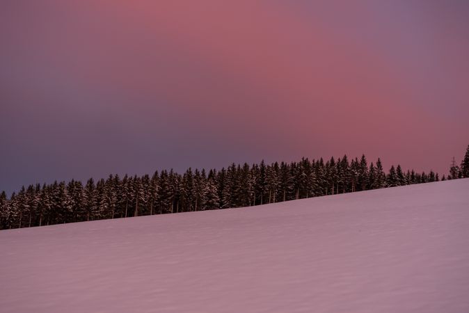 Winter scenery at golden hour in the morning with deep snow in the mountains