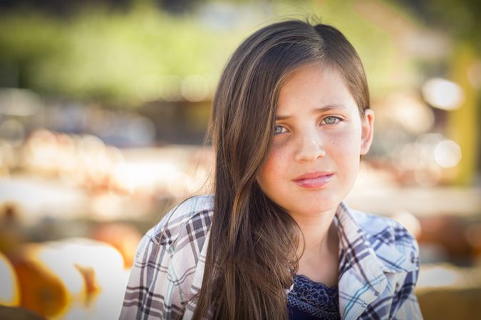 Sad Preteen Girl Portrait at the Pumpkin Patch