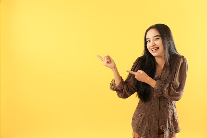 Indonesian Women Wear Traditional Clothes with Presenting Hands Gesture for  Presenting a Product