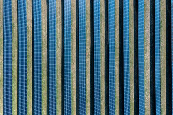 Solar panels in bright sunlight in Germany, drone aerial view