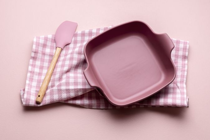 Pink oven tray on gingham towel
