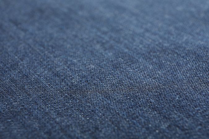 Texture of blue jeans as background, space for text