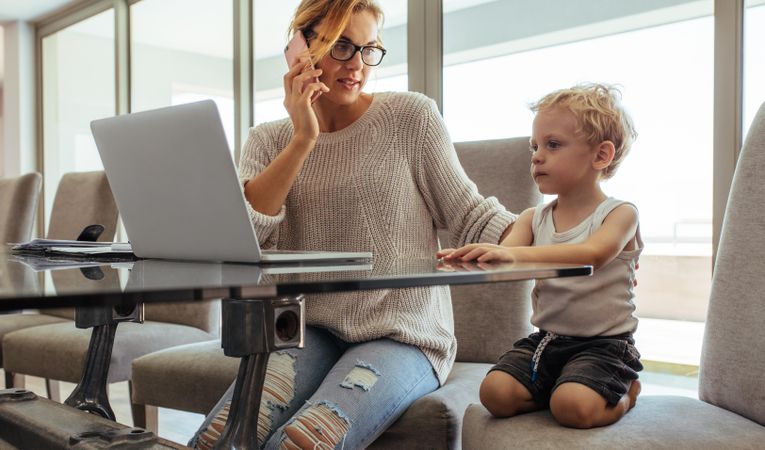 Woman with son working from home
