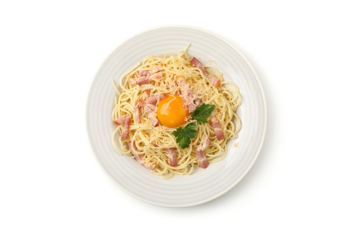 Plate with tasty pasta isolated on plain background