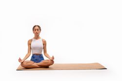 Serene yoga practice with copy space: lotus pose on eco-friendly mat