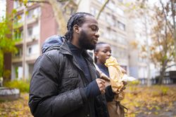 Fall Scene: Friends Holding Takeaway Food in Rainy Weather