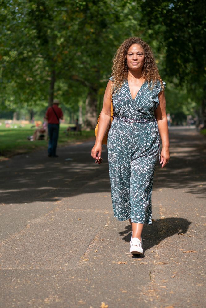 Black female walking in city