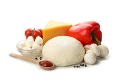 Dough and ingredients for cooking pizza isolated on blank background