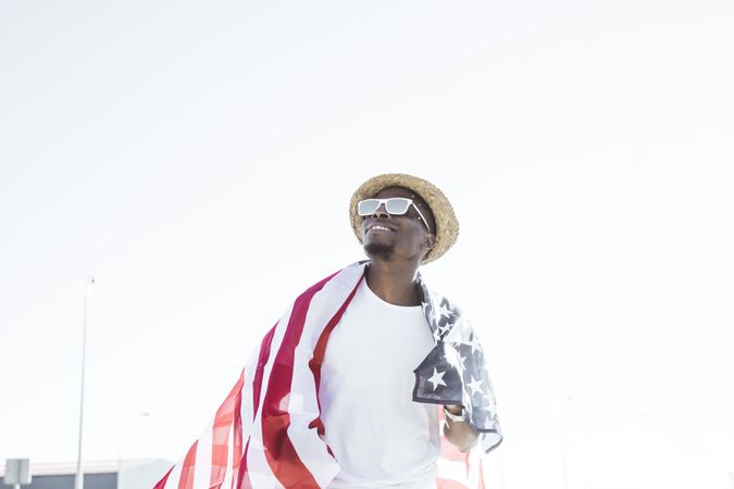 Cheerful black man with American flag