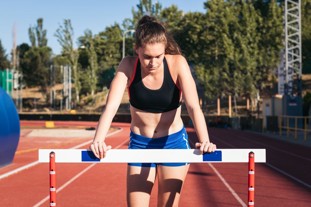 Portrait of a sporty woman on an athletics track.