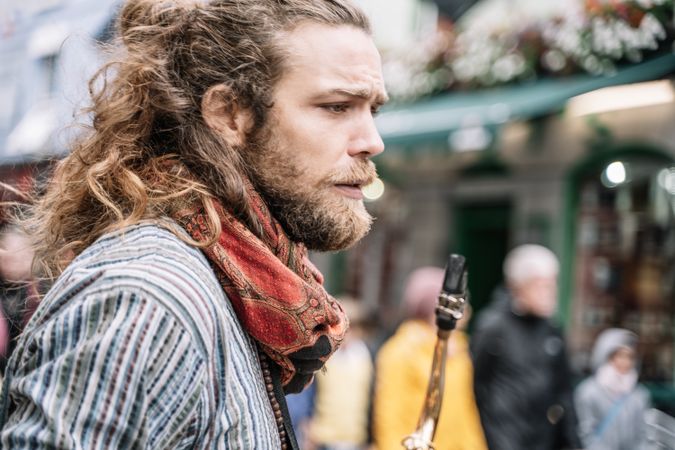 Portrait of male saxophonist in the street