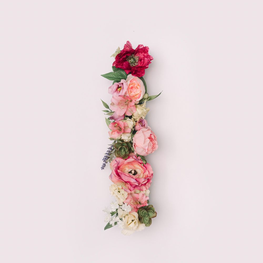 Letter I made of real natural flowers and leaves