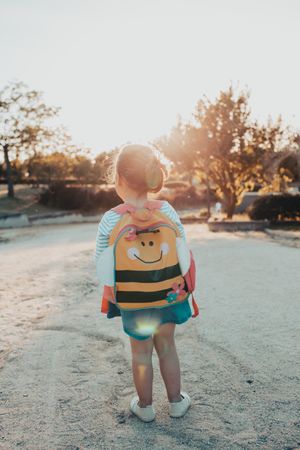 Little girl standing in park